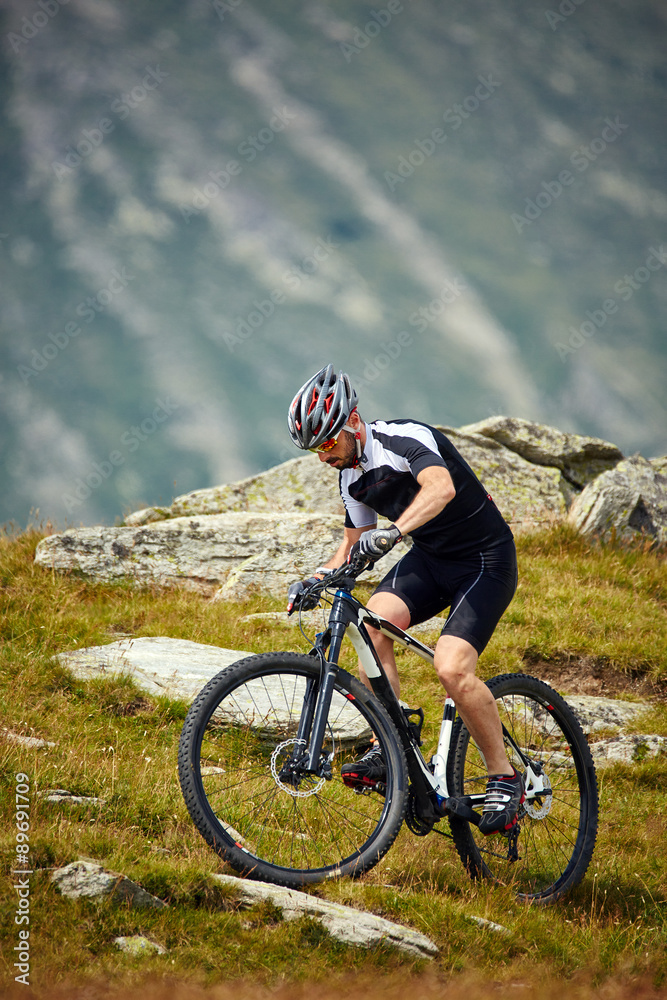 Obraz premium Mountain biker on trails