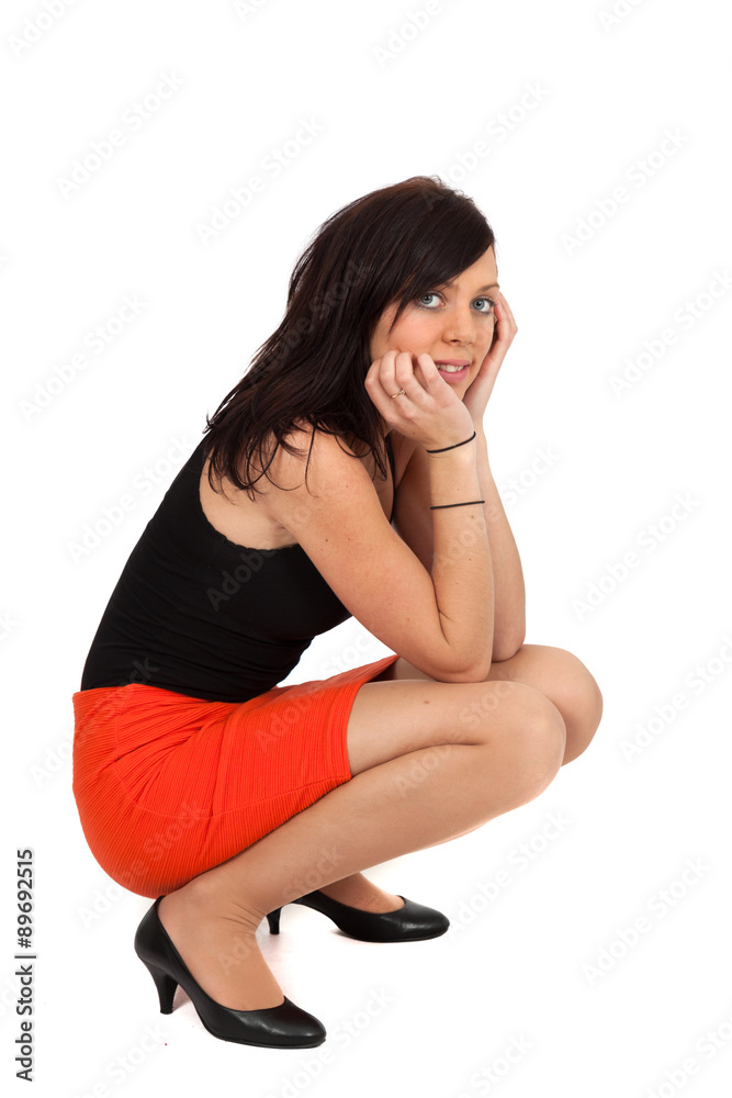 Beautiful woman doing different expressions in different sets of clothes: kneeling Beautiful woman doing different expressions in different sets of clothes: kneeling