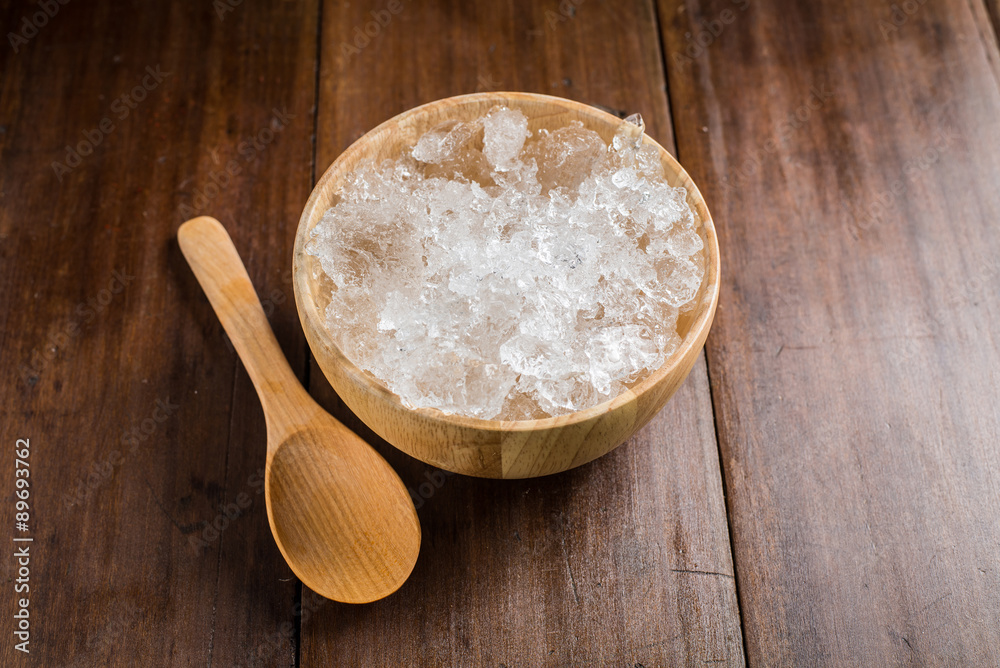 wooden Bowl with ice Cubes on wooden background wooden Bowl with ice Cubes on wooden background