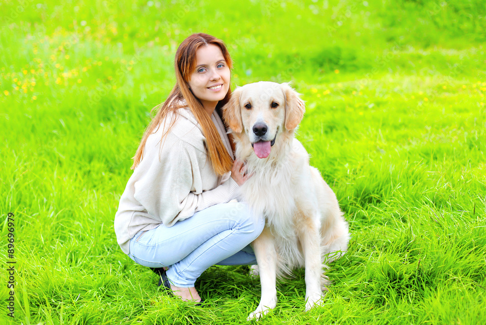 Portrait of happy owner and Golden Retriever dog together on the Portrait of happy owner and Golden Retriever dog together on the
