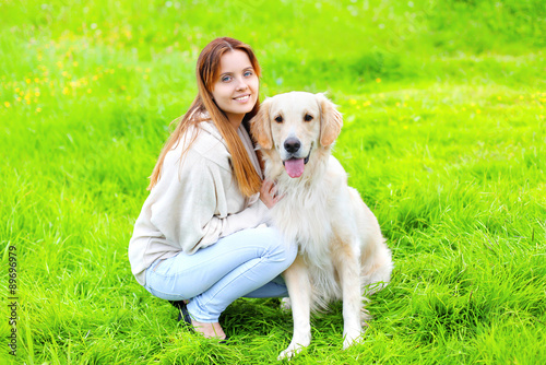 Portrait of happy owner and Golden Retriever dog together on the