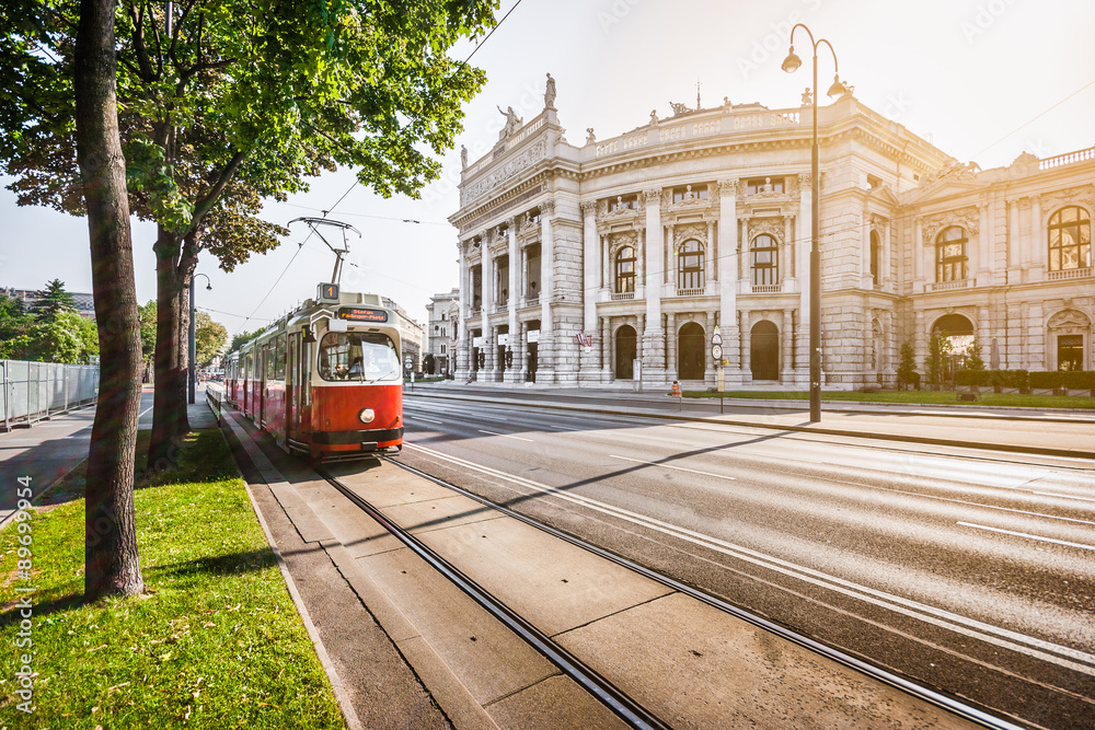 Wiener Ringstrasse with Burgtheater and tram at sunrise, Vienna, Austria