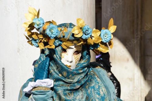 Traditional textile green outfit of an isolated mask during the Carnival of Venice  Italy