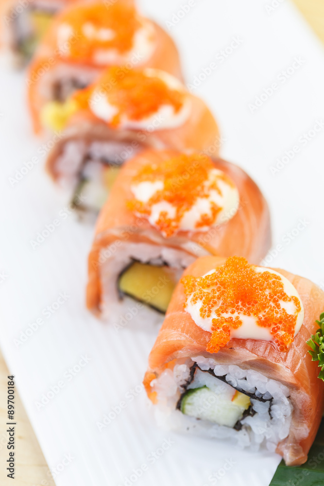 Traditional japanese food, Salmon sushi roll maki Traditional japanese food, Salmon sushi roll maki