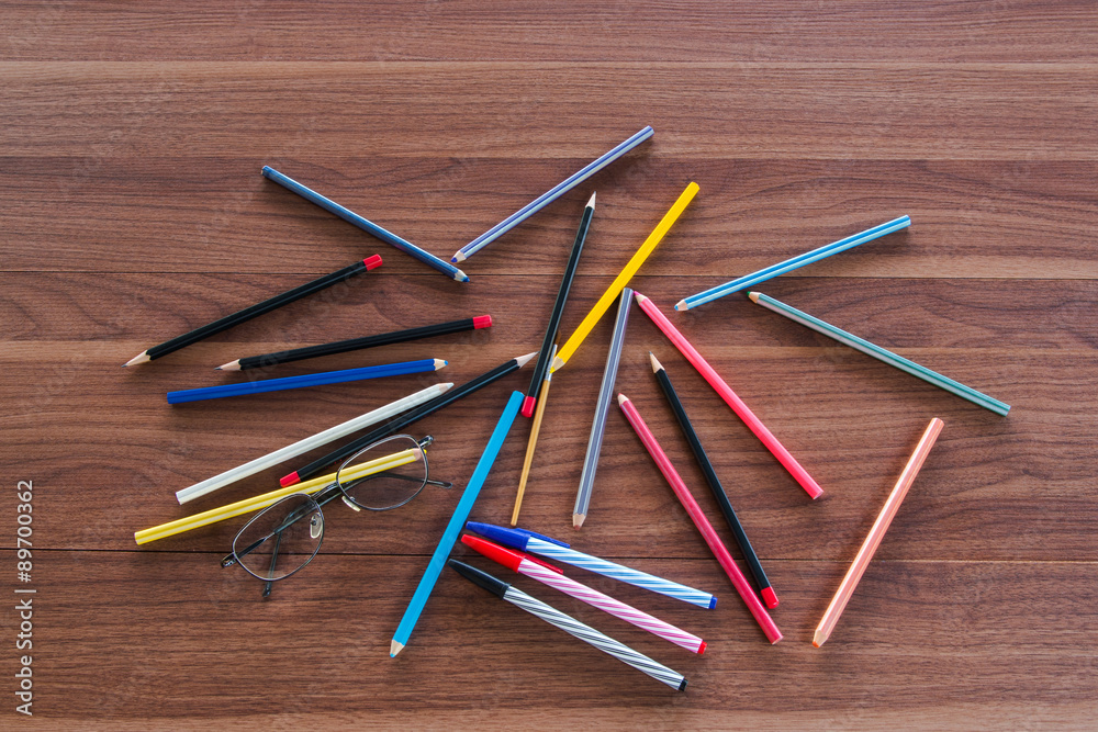 Obraz premium Group of multi color pencil and pen on the table