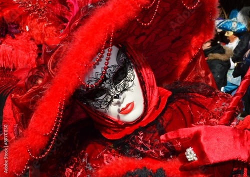 Red costume and murano pearls during the Venetian carnival in Italy