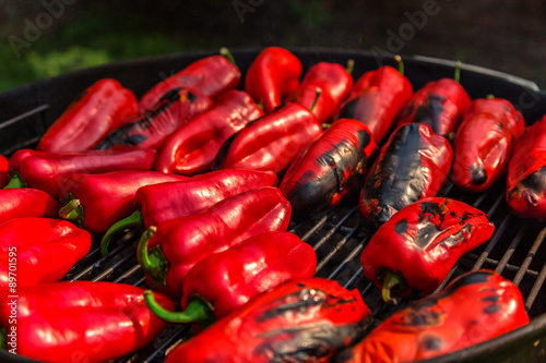Fotografija Baked red capsicum or bell peppers on grill
