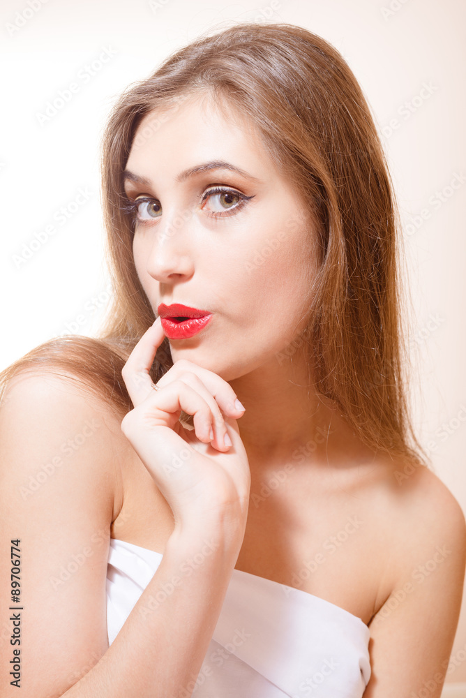 Closeup picture of astonished young female with her finger on Closeup picture of astonished young female with her finger on