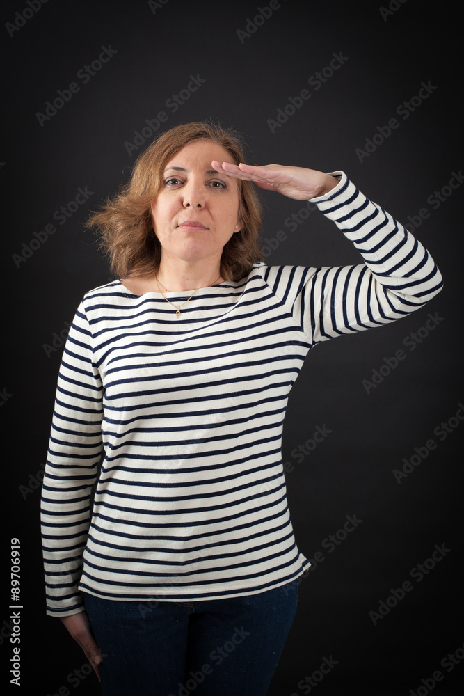 Beautiful woman doing different expressions in different sets of clothes: at attention Beautiful woman doing different expressions in different sets of clothes: at attention