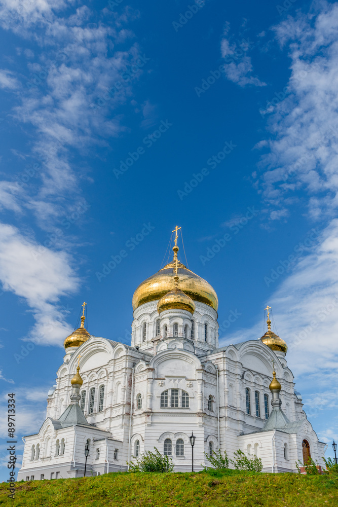 Belogorsky Cathedral. Russian Orthodox Church with golden domes under blue skies.