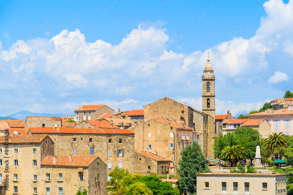 View of church in Sartene village with stone houses built in traditional Corsican style, France