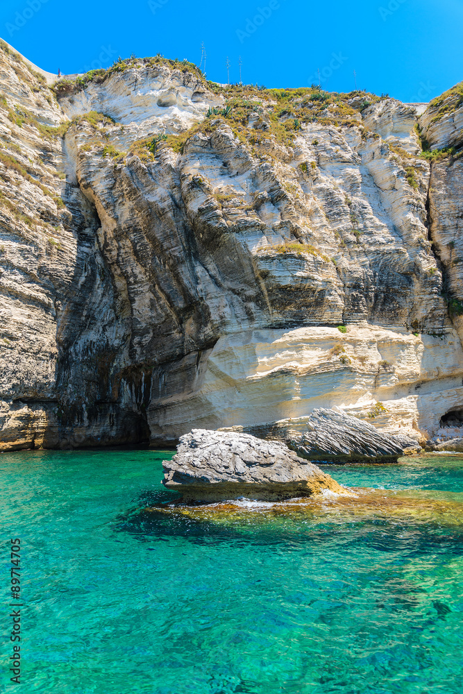 Crystal clear sea water and white cliff rocks near Bonifacio town, Corsica island, France