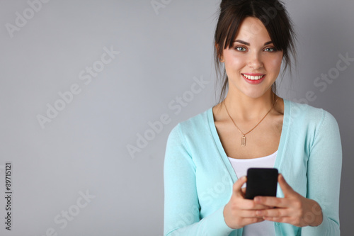 Woman using and reading a smart phone 