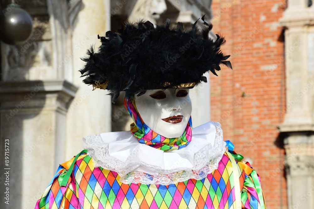 Smiling mask with black hat during the Carnival of Venice in Italy