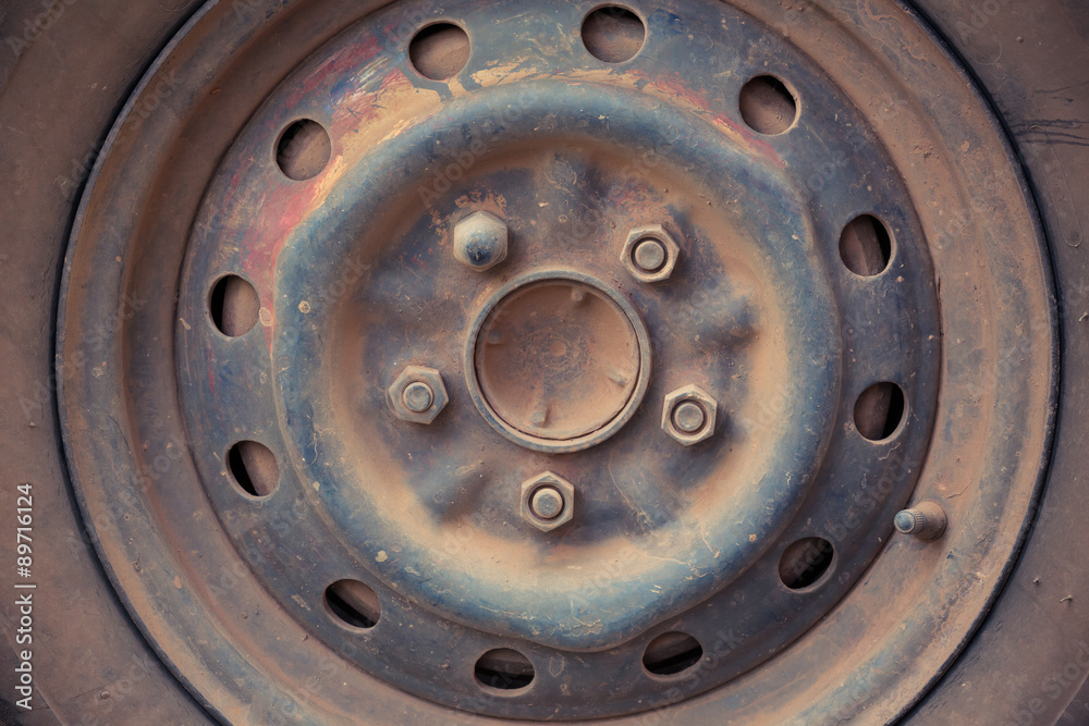 scrap wheel of car abandoned, close up image