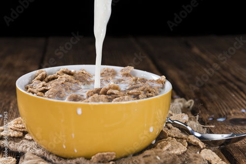 Pouring Milk on a portion of Cornflakes photo