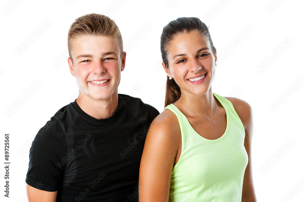 Cute teen couple in sportswear.