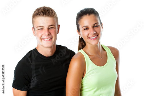 Cute teen couple in sportswear.