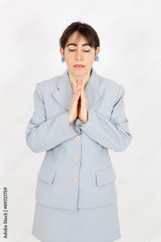 Beautiful woman doing different expressions in different sets of clothes: praying Beautiful woman doing different expressions in different sets of clothes: praying