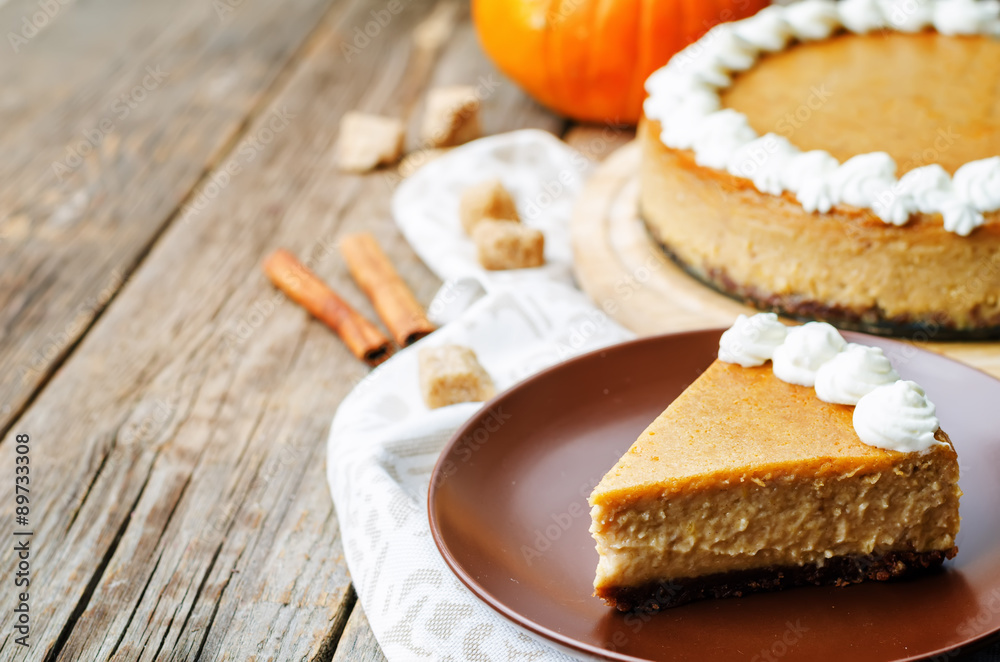 pumpkin cheesecake decorated with whipped cream pumpkin cheesecake decorated with whipped cream