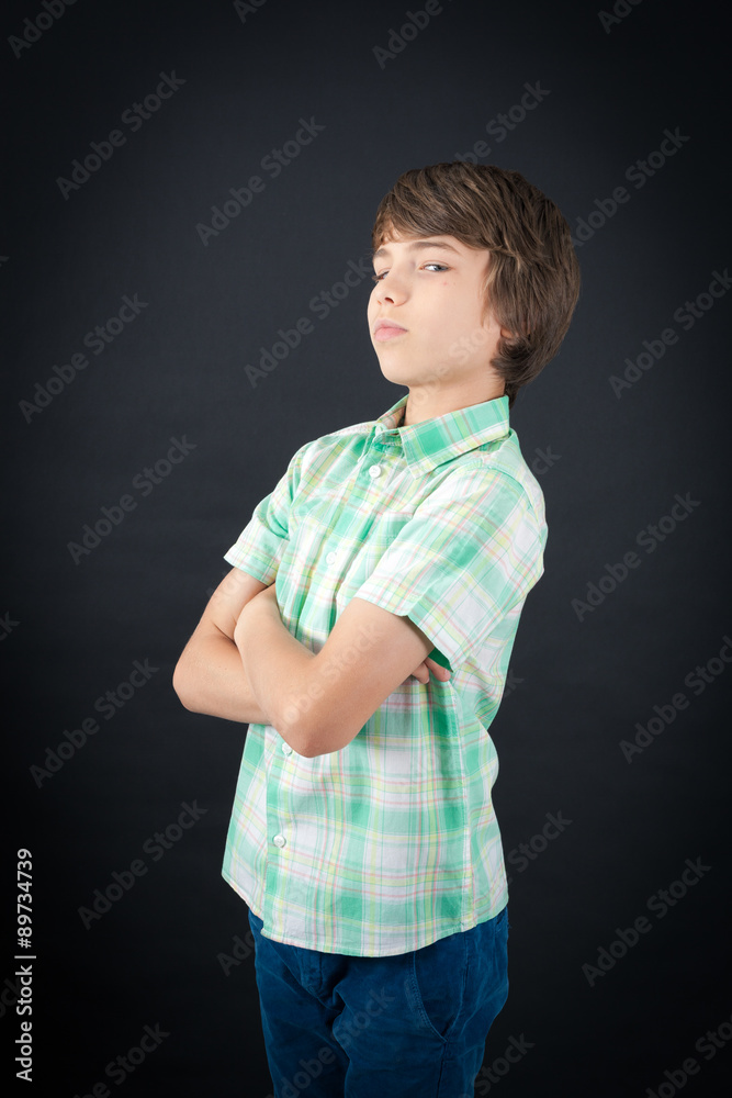 Handsome boy doing different expressions in different sets of clothes: arms crossed Handsome boy doing different expressions in different sets of clothes: arms crossed