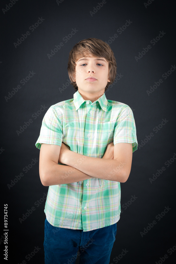Handsome boy doing different expressions in different sets of clothes: arms crossed Handsome boy doing different expressions in different sets of clothes: arms crossed