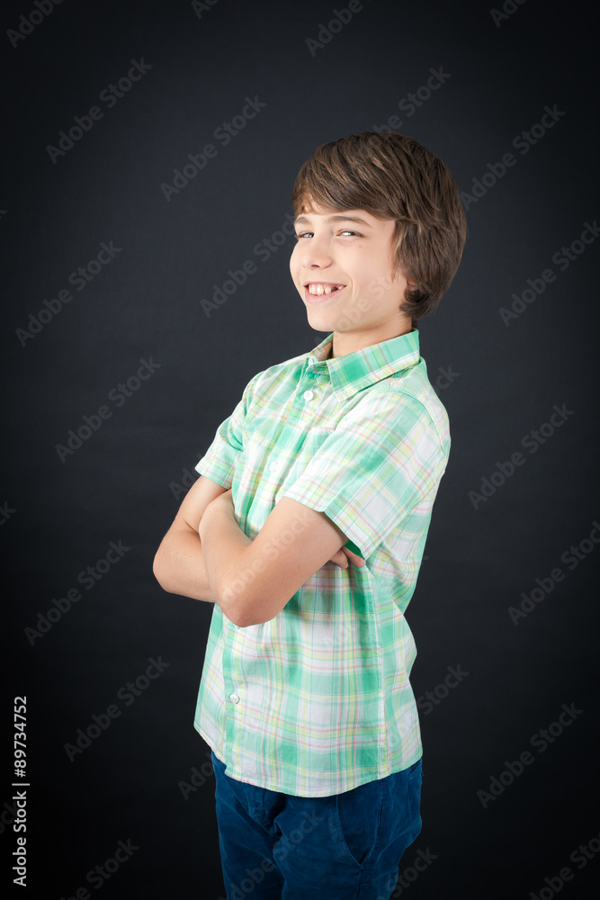Handsome boy doing different expressions in different sets of clothes: arms crossed Handsome boy doing different expressions in different sets of clothes: arms crossed