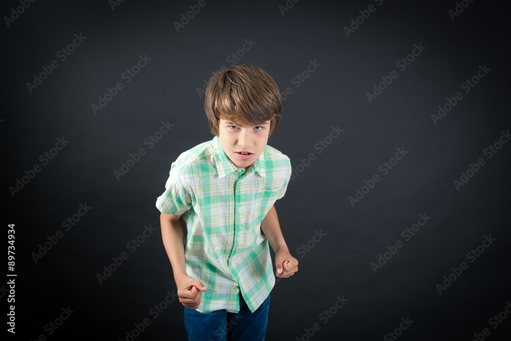 Handsome boy doing different expressions in different sets of clothes: angry Handsome boy doing different expressions in different sets of clothes: angry