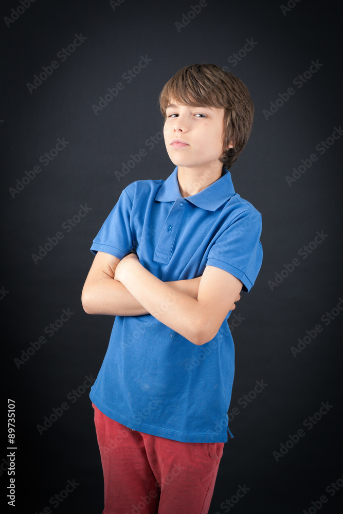 Handsome boy doing different expressions in different sets of clothes: arms crossed Handsome boy doing different expressions in different sets of clothes: arms crossed