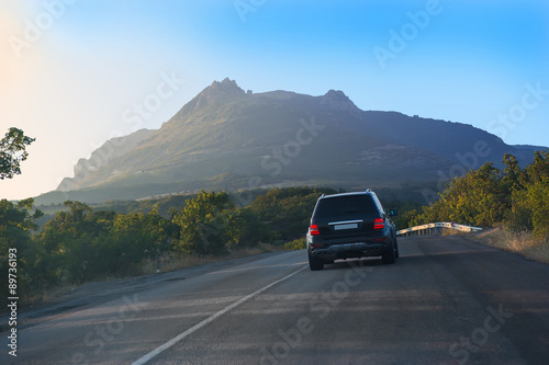 SUV on road in mountain © Yuri Bizgaimer