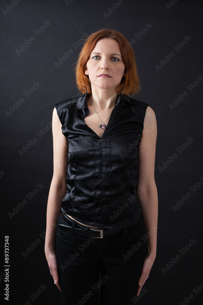Beautiful woman doing different expressions in different sets of clothes: at attention Beautiful woman doing different expressions in different sets of clothes: at attention