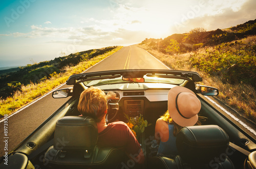 Happy Couple Driving in Convertible