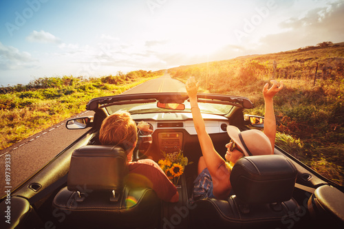 Happy Couple Driving in Convertible