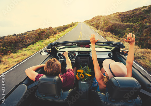 Happy Couple Driving in Convertible