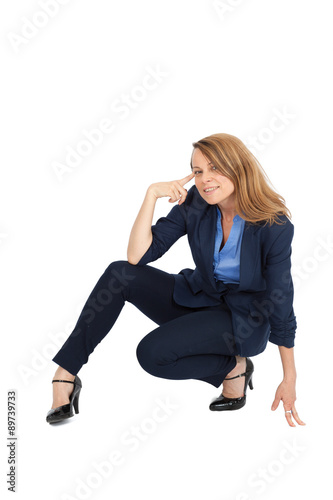 Beautiful businesswoman doing different expressions in different sets of clothes: posing
