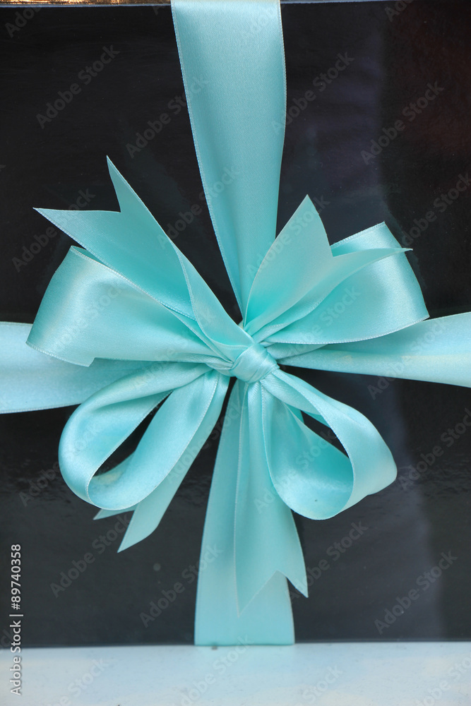 Fototapeta premium Gift box with blue ribbon