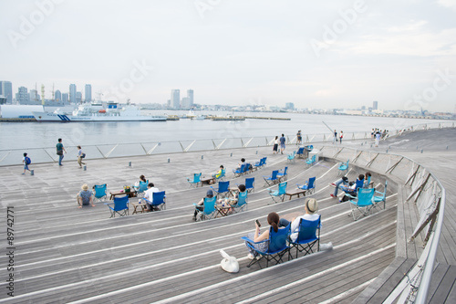 People are relaxing at Minatomirai bay area, Yokohama in Japan