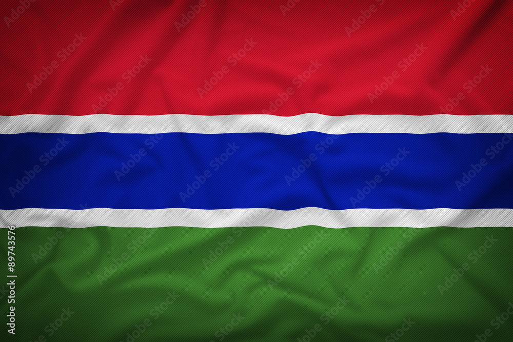 Obraz premium Gambia flag on the fabric texture background,Vintage style
