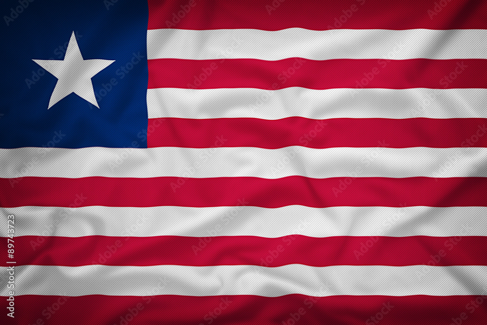Fototapeta premium Liberia flag on the fabric texture background,Vintage style