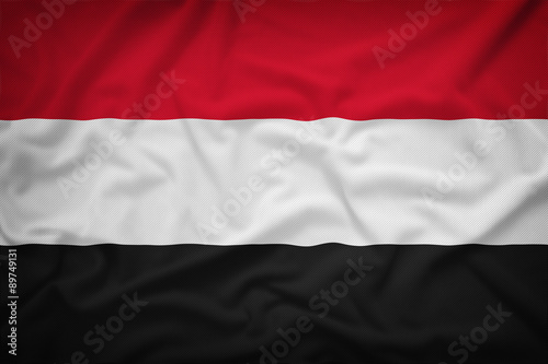 Yemen flag on the fabric texture background,Vintage style
