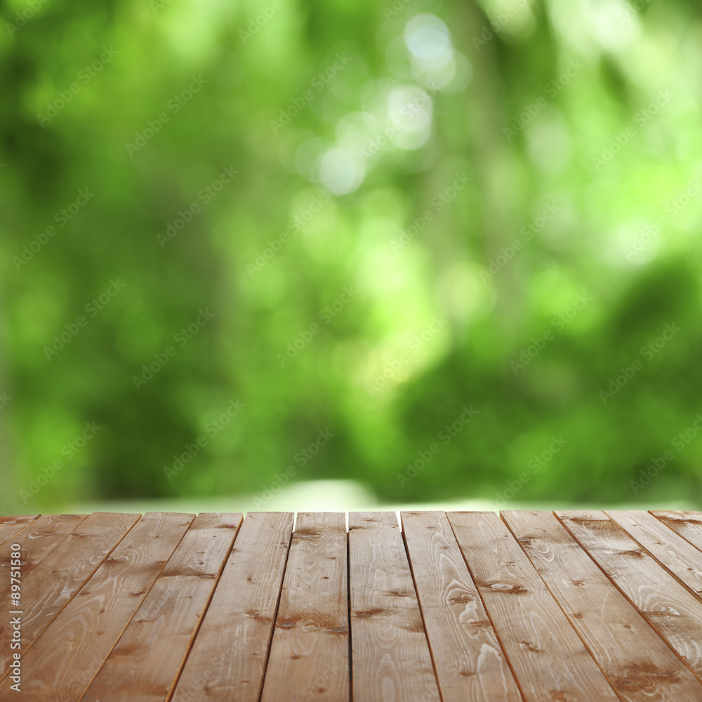 Wooden table with abstract blur background Wooden table with abstract blur background
