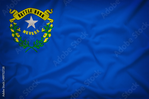 Nevada flag on the fabric texture background,Vintage style