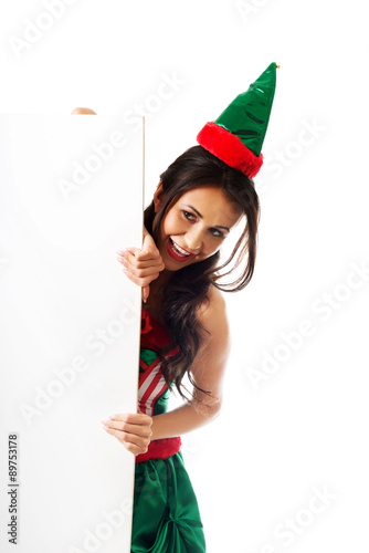 Woman wearing elf clothes with white banner