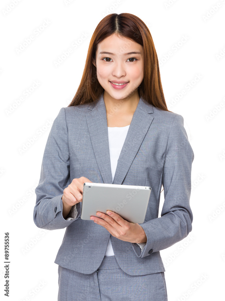 Asian businesswoman use of the tablet pc Asian businesswoman use of the tablet pc