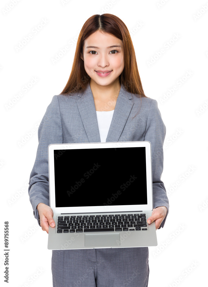 Young businesswoman show with the blank screen of laptop compute Young businesswoman show with the blank screen of laptop compute