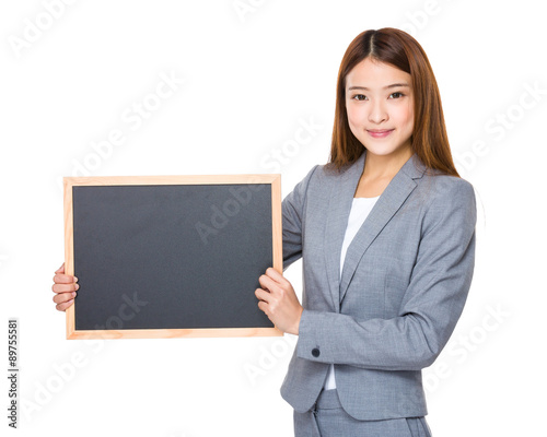 Asian young businesswoman show with empty blackboard