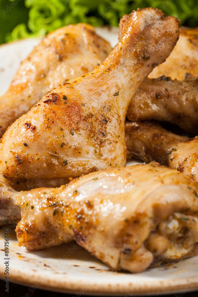 Baked chicken legs on plate
