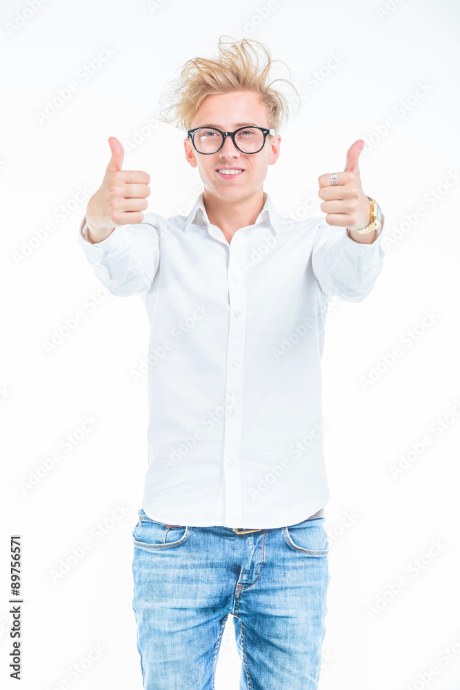 Happy young man showing the thums up gesture while Happy young man showing the thums up gesture while