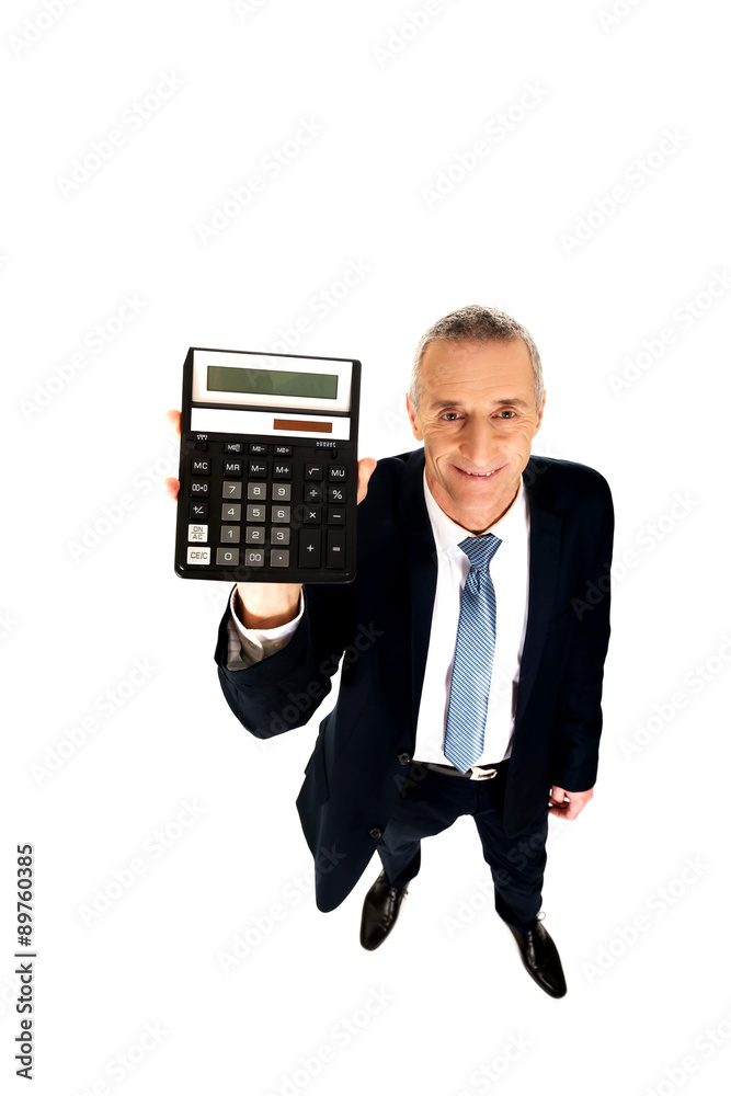 Happy businessman holding a calculator Happy businessman holding a calculator