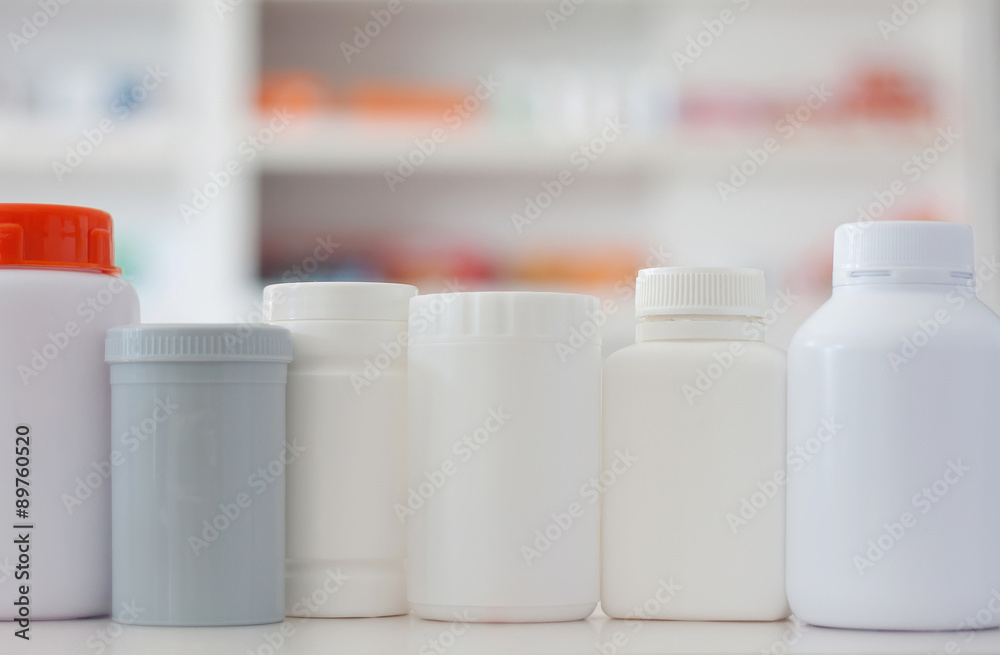 many medicine bottle with blur shelves of drug in the pharmacy d many medicine bottle with blur shelves of drug in the pharmacy d